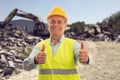 Cheerful old builder making double like gesture construction