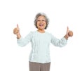 A Cheerful Old Casual Woman Giving a Thumbs Up Royalty Free Stock Photo