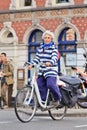 Cheerful old lady on a white bicycle, Amsterdam, Netherlands