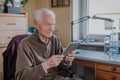 Positive Senior using Digital Tablet Royalty Free Stock Photo