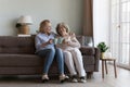 Cheerful older 80s grandma and middle aged daughter enjoying leisure Royalty Free Stock Photo