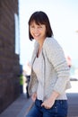 Cheerful older woman laughing outdoors