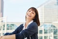 Cheerful older woman sitting outside in city Royalty Free Stock Photo