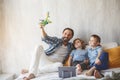 Cheerful parent playing with glad children