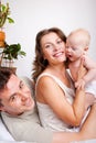 Cheerful parents and a baby