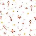 Festive Candy Canes and Golden Stars Pattern on a White Background