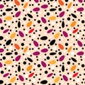 A cheerful pattern of sesame seeds on a peach background.