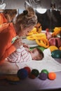 Cheerful pediatrician doing physical activity for toddler