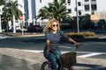 Cheerful people caucasian woman smile and enjoy bike ride in outdoor leisure activity in the city - active female have fun and Royalty Free Stock Photo