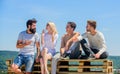 Cheerful people communicating. Men and woman talking nature background. Hang out together. Youth relaxing. Summer Royalty Free Stock Photo