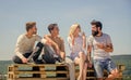 Cheerful people communicating. Men and woman talking nature background. Hang out together. Youth relaxing. Summer Royalty Free Stock Photo