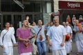 Cheerful people in Indian clothes, Hare Krishna believers, dancing, singing and playing drums on the street. Kyiv