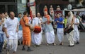 Cheerful people in Indian clothes, Hare Krishna believers, dancing, singing and playing drums on the street. Kyiv