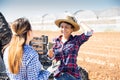 Cheerful Peruvian woman farmer talking to young workwoman