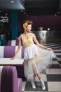 cheerful pin up waitress holding skirt Royalty Free Stock Photo