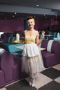 cheerful pin up waitress holding tray Royalty Free Stock Photo