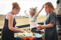 Cheerful and playful friends laughing, dancing and make a barbecue Royalty Free Stock Photo