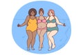 Cheerful plus size women dressed in swimsuit stand hugging on sunny beach near sea water Royalty Free Stock Photo