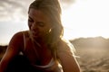 Cheerful portrait of beautiful young blonde girl smiling and enjoying the outdoor - sexy woman with long hair and sun backlight in Royalty Free Stock Photo