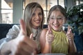 Cheerful portrait of a young woman and her teenage daughter. Mother and her grown up daughter Royalty Free Stock Photo