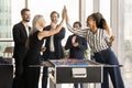 Cheerful positive colleagues women giving high five over game board Royalty Free Stock Photo