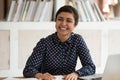 Cheerful positive indian female student talking with somebody aside.