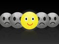 Cheerful positive and sad emoticons on dark background.