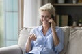 Cheerful positive senior woman speaking on cell, enjoying funny talk, Royalty Free Stock Photo