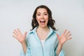 Cheerful positive young woman raising her fists with smiling delighted expression Royalty Free Stock Photo