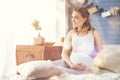 Cheerful pregnant woman resting in bed Royalty Free Stock Photo