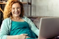 Cheerful pregnant woman working with a laptop Royalty Free Stock Photo