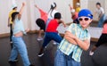 Happy tweens practicing hip hop in dance studio Royalty Free Stock Photo