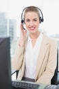 Cheerful pretty agent wearing headset dealing with customer Royalty Free Stock Photo