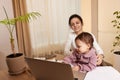 businesswoman working at home with her little child girl Royalty Free Stock Photo