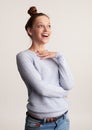 Cheerful pretty girl in sweater laughing