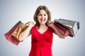 Cheerful pretty woman is shopping with colorful bags Royalty Free Stock Photo