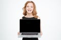 Cheerful pretty young business woman holding blank screen laptop Royalty Free Stock Photo