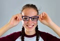 Cheerful pretty young woman with glasses.