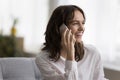 Cheerful pretty young woman talking on cell, making call