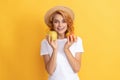 cheerful redhead girl in straw hat hold apple, vitamin