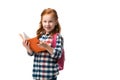 cheerful redhead kid holding orange book isolated on white. Royalty Free Stock Photo
