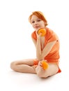 Cheerful redhead with two oranges Royalty Free Stock Photo