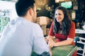 Cheerful romantic couple flirting in cafe Royalty Free Stock Photo