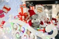 Cheerful Santa carries gifts to children on his sleigh with reindeer macro photo Royalty Free Stock Photo