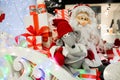 Cheerful Santa carries gifts to children on his sleigh with reindeer macro photo Royalty Free Stock Photo