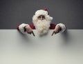 Santa Claus pointing at blank sign Royalty Free Stock Photo