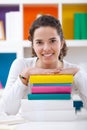 Cheerful schoolgirl with books