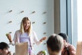 cheerful schoolgirl gesturing while talking to