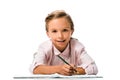 cheerful schoolkid smiling and holding pencil near notebook isolated on white.