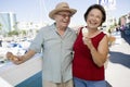 Cheerful Senior Caucasian Couple Holding Ice-creams